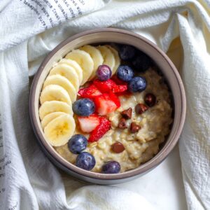 Breakfast Oatmeal with Fresh Fruits and Chocolate Chips served in a Bowl