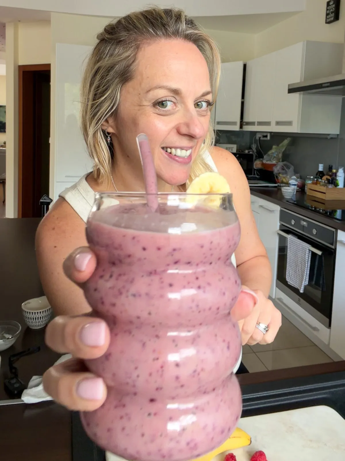 Banana Avocado Berries Smoothie, drinking from a glass