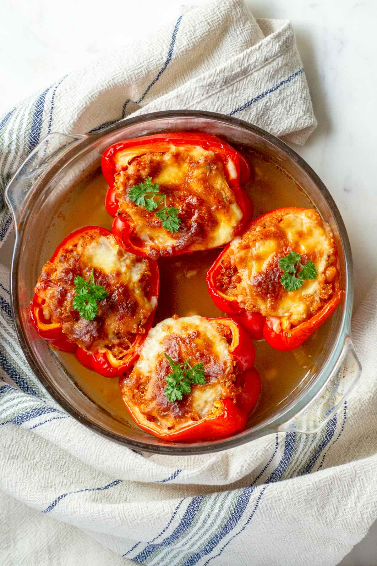 Stuffed bell peppers without meat in a baking dish.