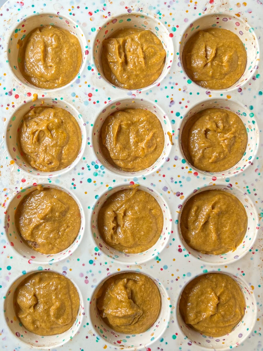 The best moist pumpkin muffins, spoon in batter into the muffin cups.