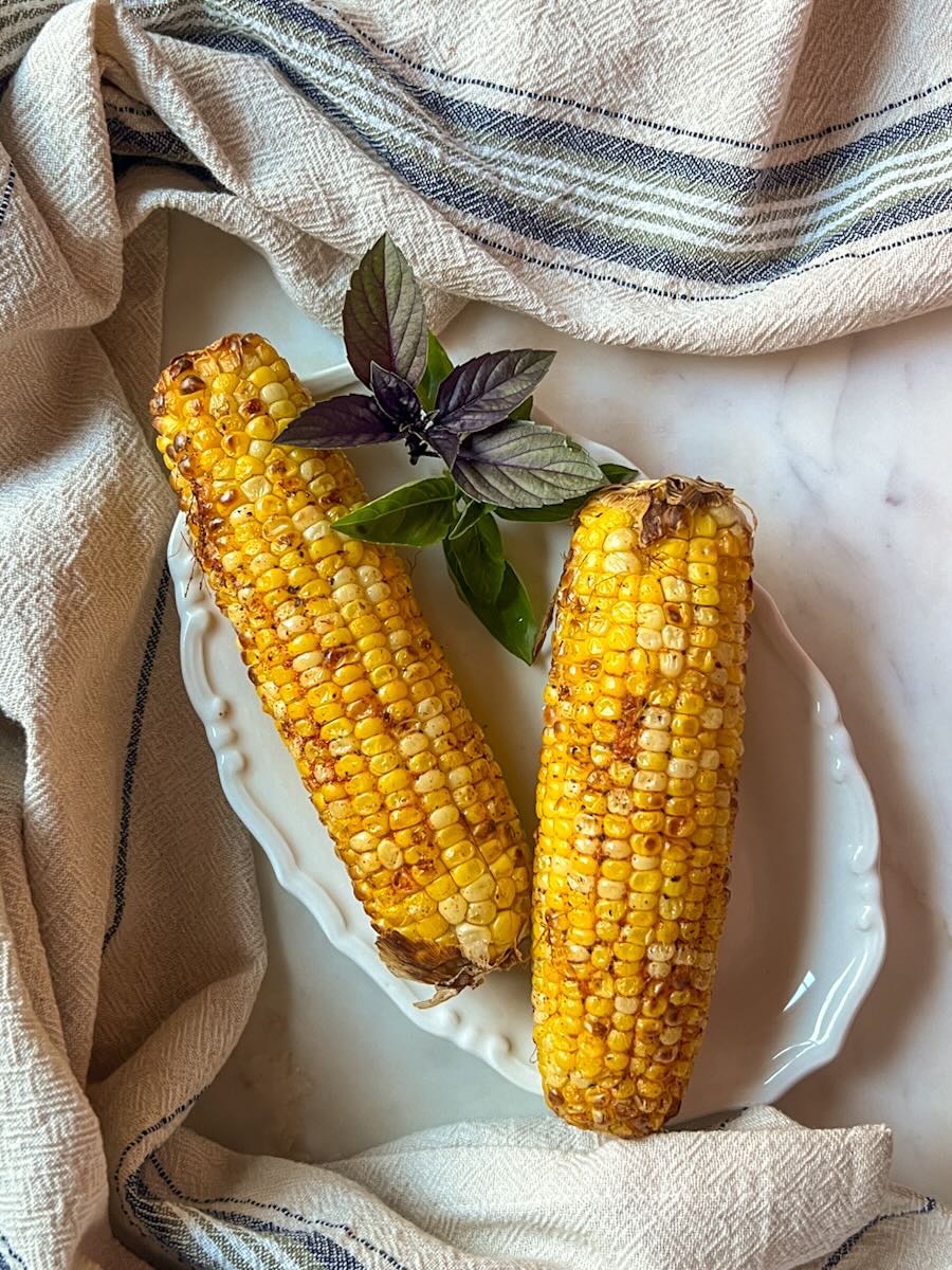 Ninja air fryer corn on the cob, serve the corn warm.