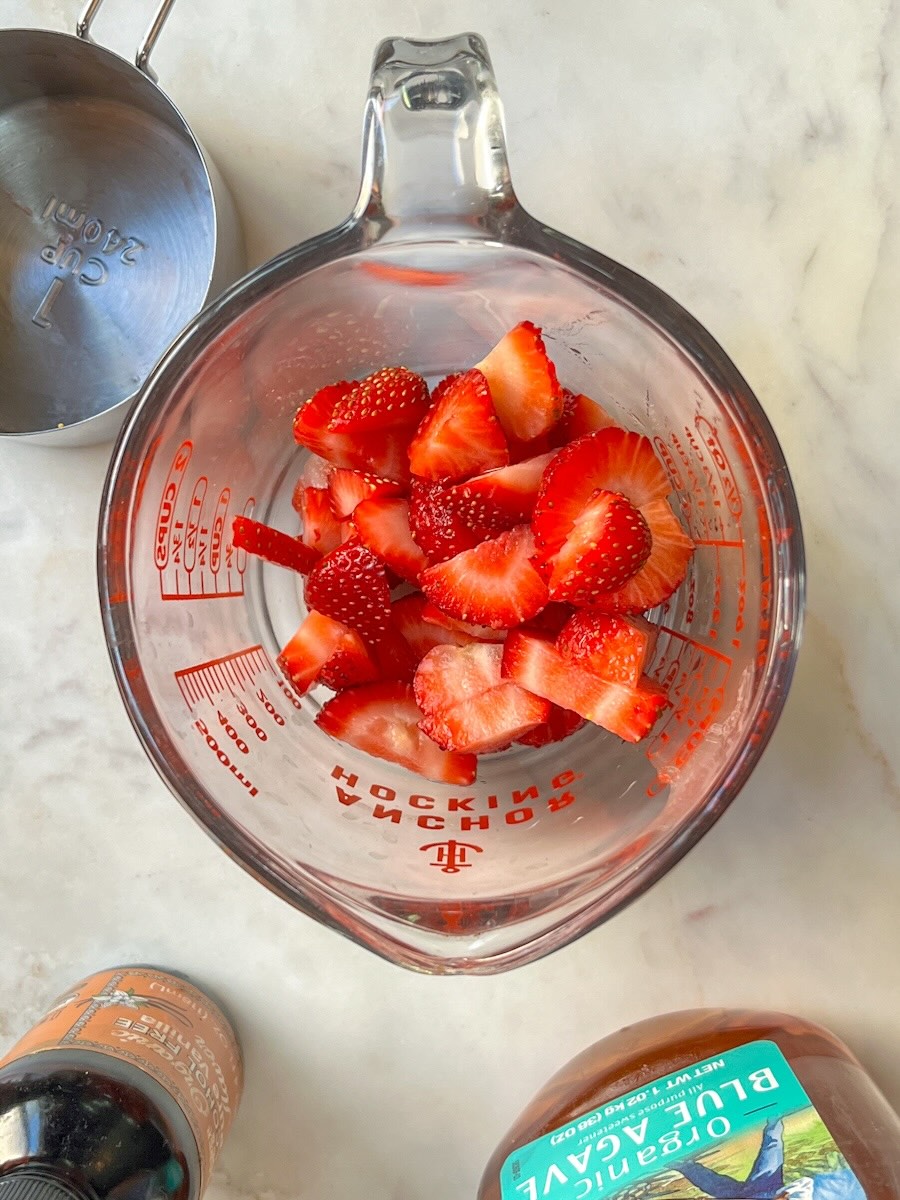 Strawberry Yogurt recipe, wash, chop and place strawberries in a bowl.