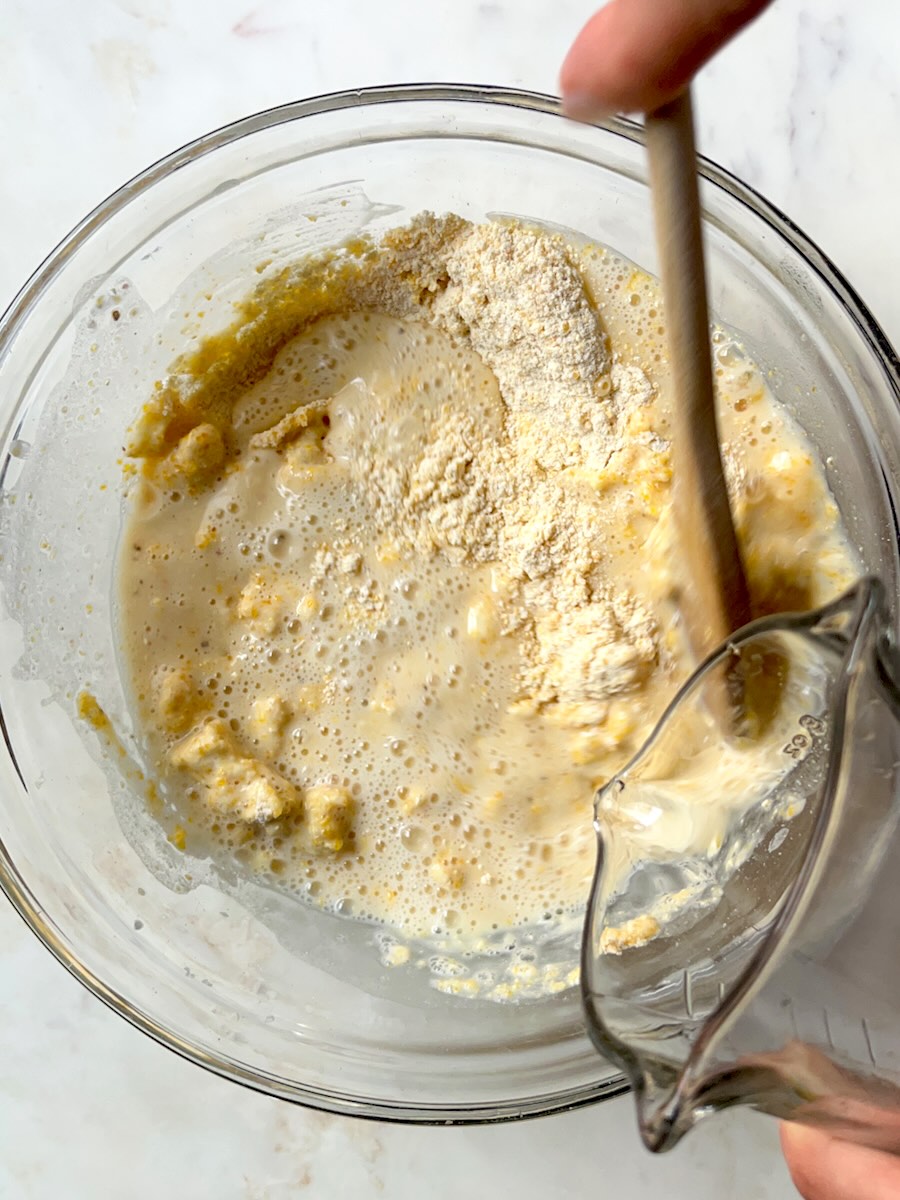 Cornmeal Muffins with Feta (Projice sa Sirom), add the wet ingredients to the dry ingredients.
