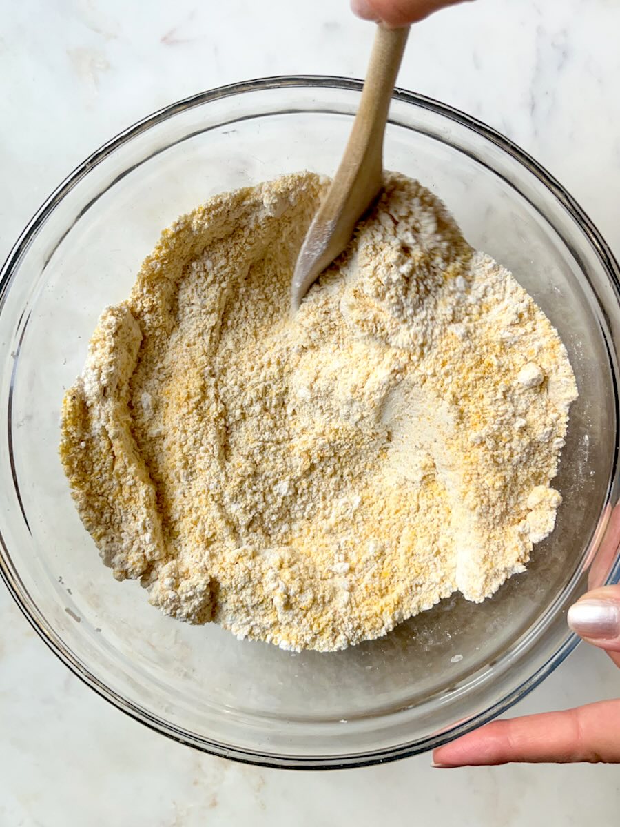 Cornmeal Muffins with Feta (Projice sa Sirom), mix dry ingredients.
