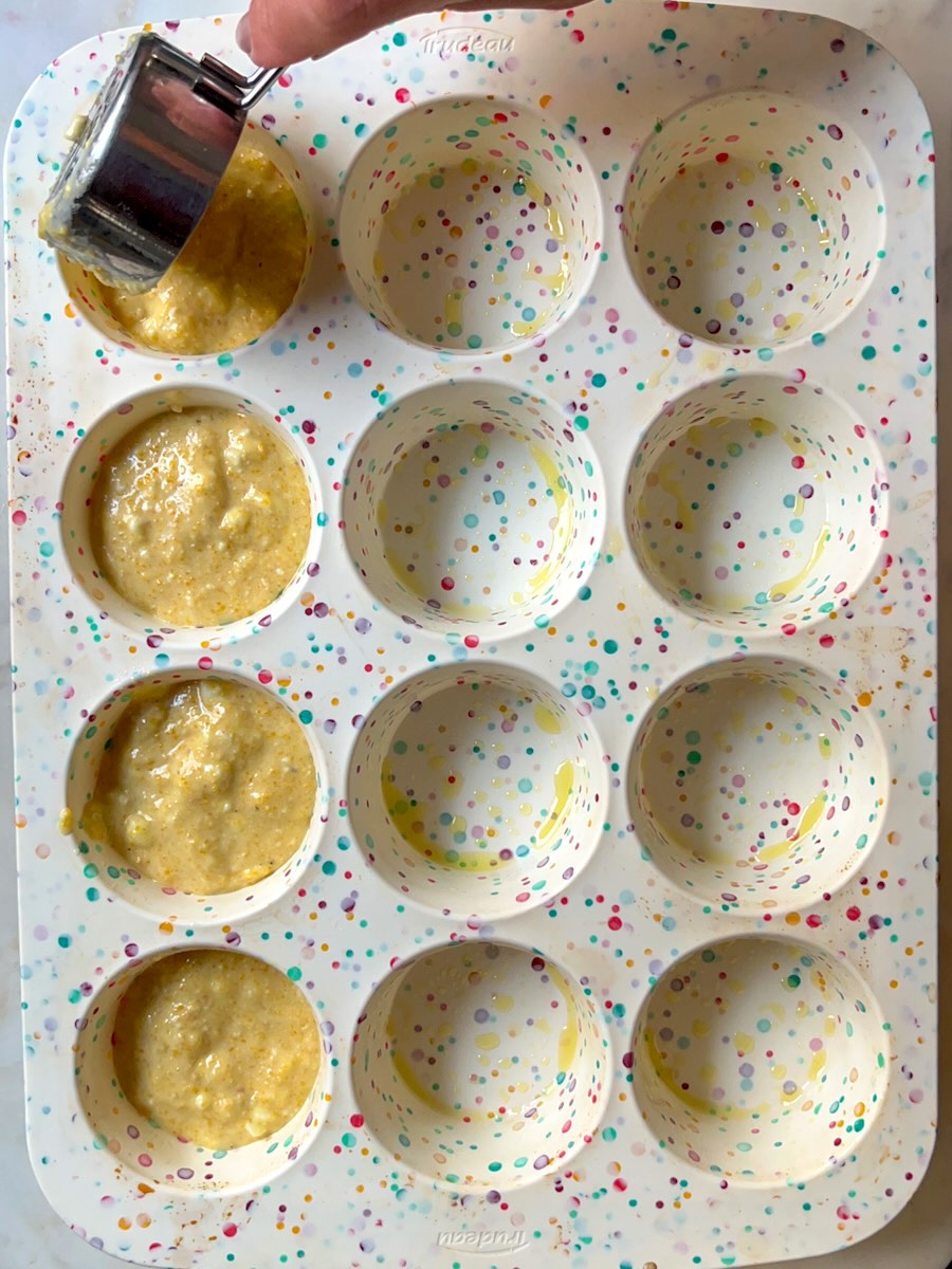Cornmeal Muffins with Feta (Projice sa Sirom), spoon the batter into the muffin cups.