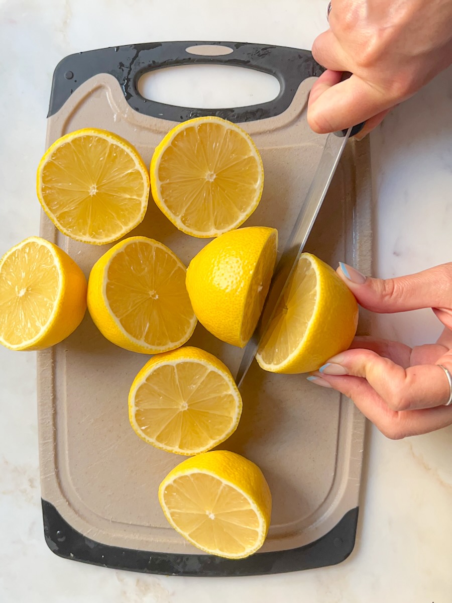 Ginger Lemonade, cut and juice the lemons.