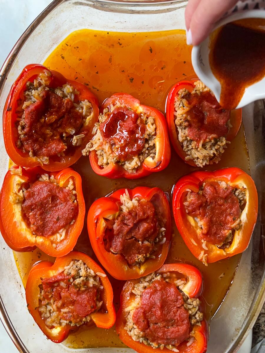 Gluten Free Meat and Rice Stuffed Peppers, Add Paprika Oil Mix to Stuffed Peppers.
