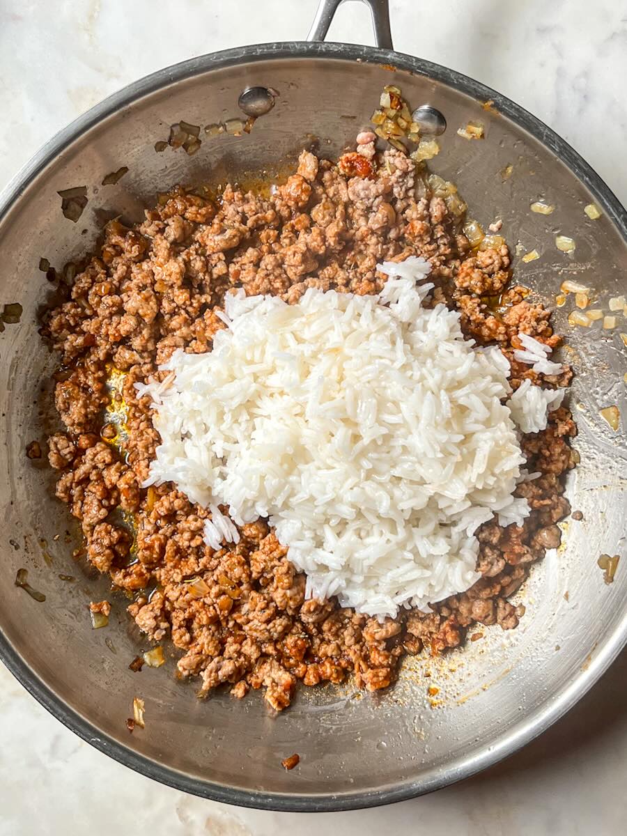 Gluten Free Meat and Rice Stuffed Peppers, Stir in Cooked Rice.