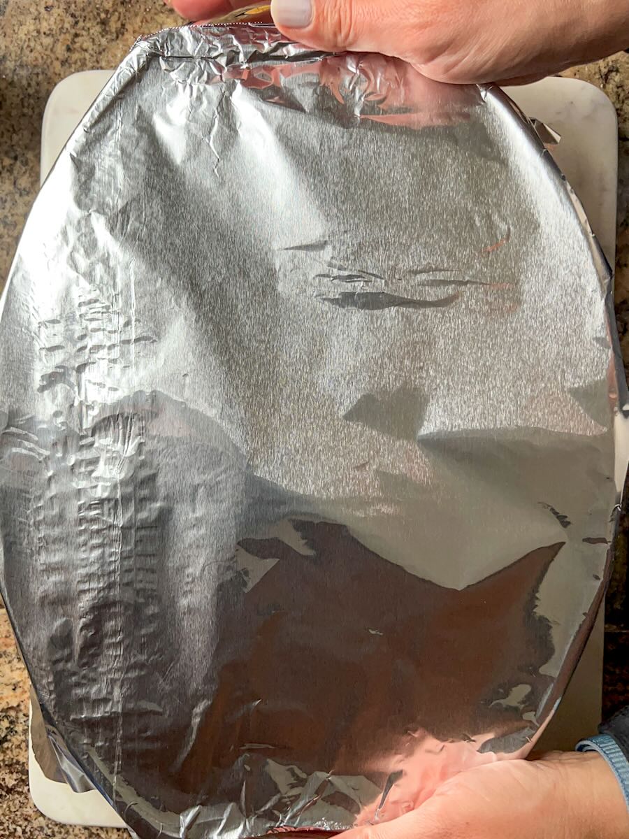 Gluten Free Meat and Rice Stuffed Peppers, cover with the aluminum foil.