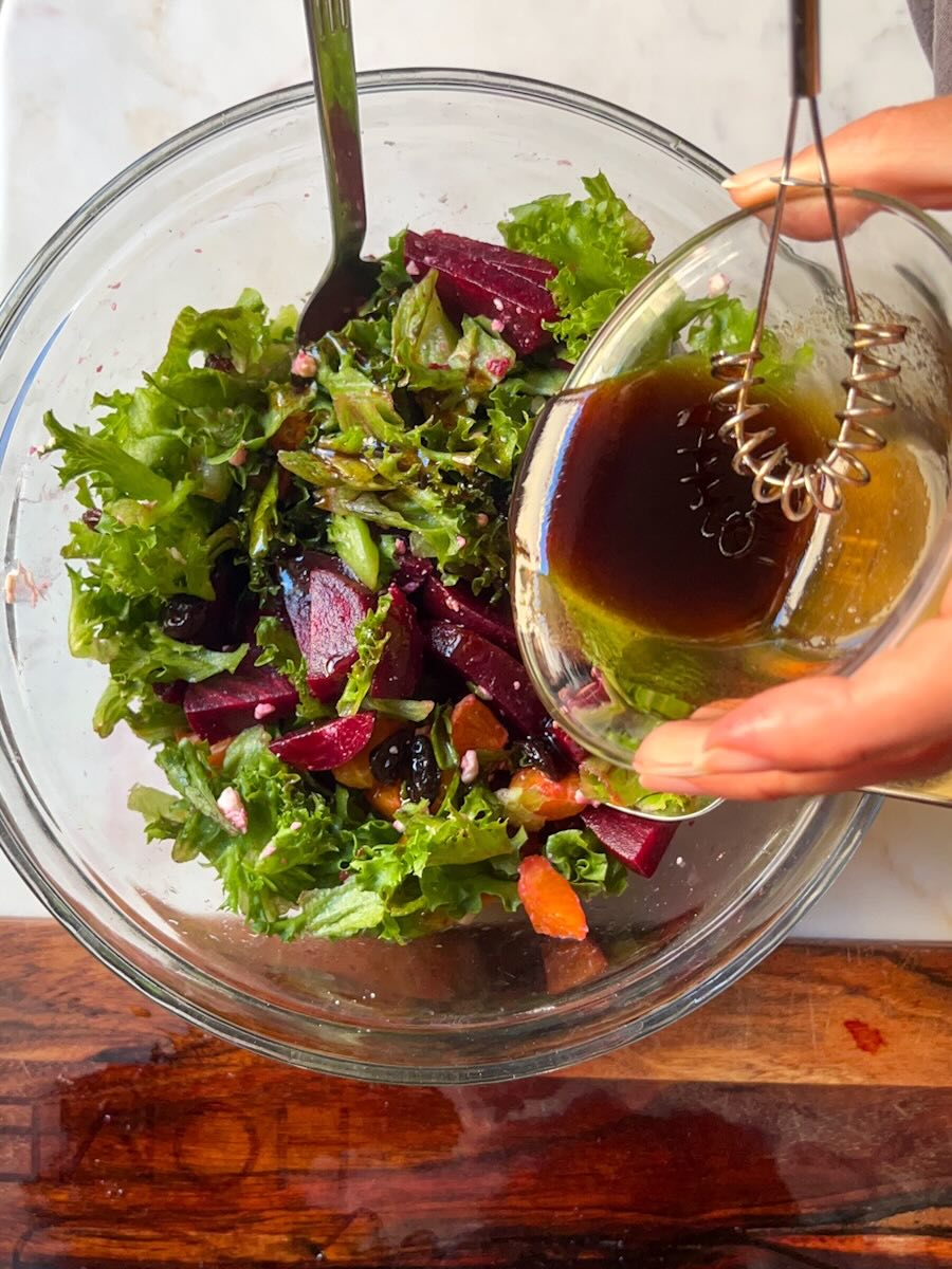 Beet Salad with Mandarin Oranges, Drizzle the salad with the dressing, tossing gently.