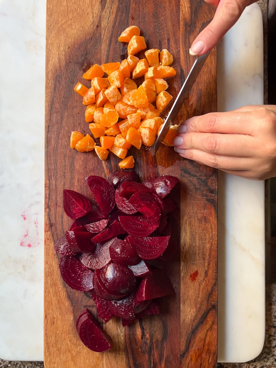 Beet Salad with Mandarin Oranges, Peel the mandarin oranges and separate them into segments. Cut them into smaller pieces.