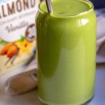 Green smoothie with avocado and spinach in a cup