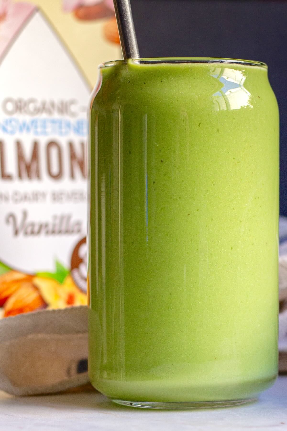 Green smoothie with avocado and spinach in a cup