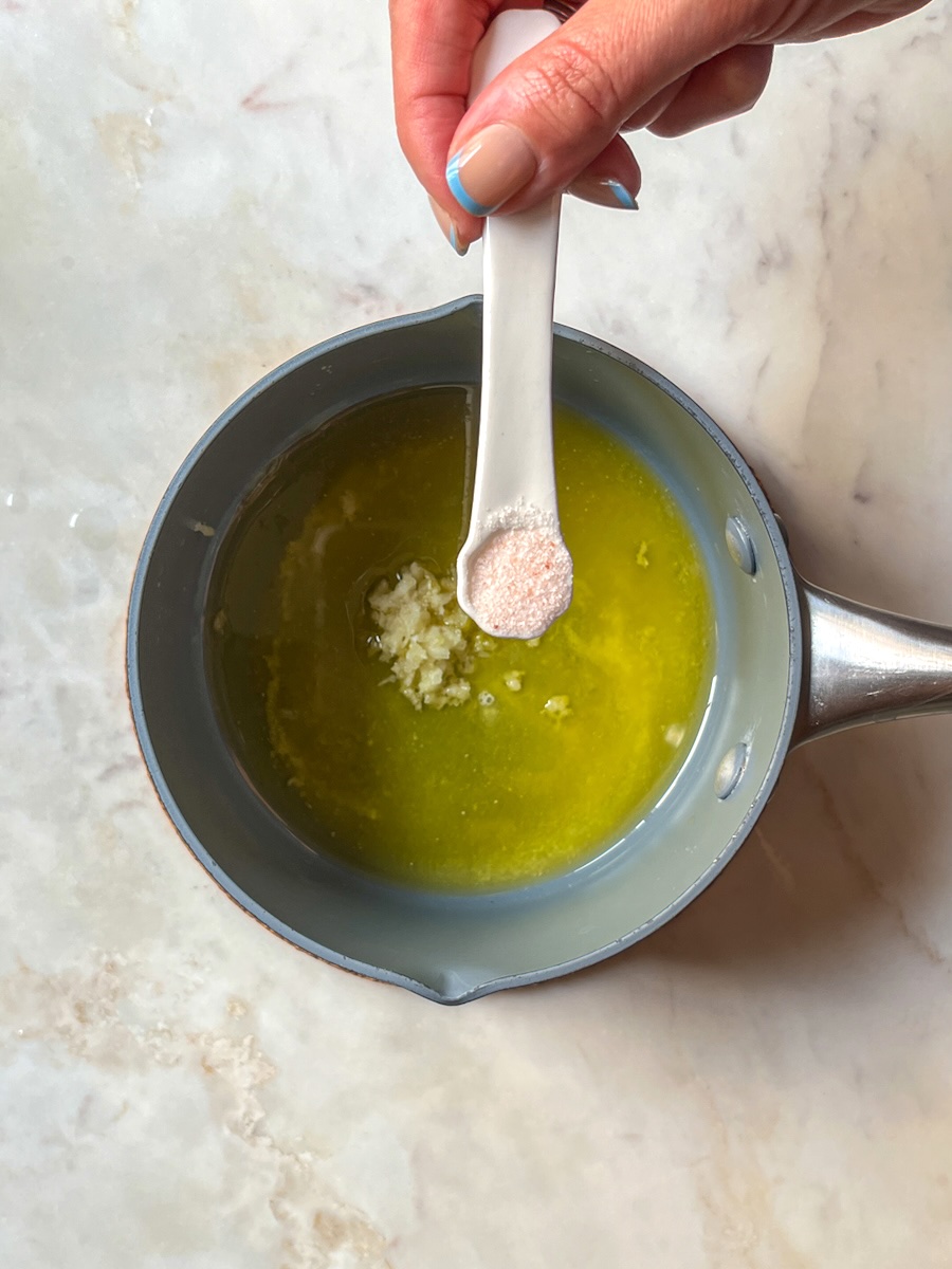 Steamed Broccolini with garlic and lemon, add garlic and salt to the mixture of butter and oil.