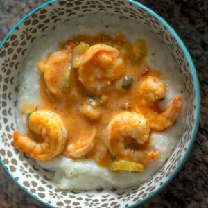 Prosciutto Shrimp served over Creamy Grits in a serving bowl