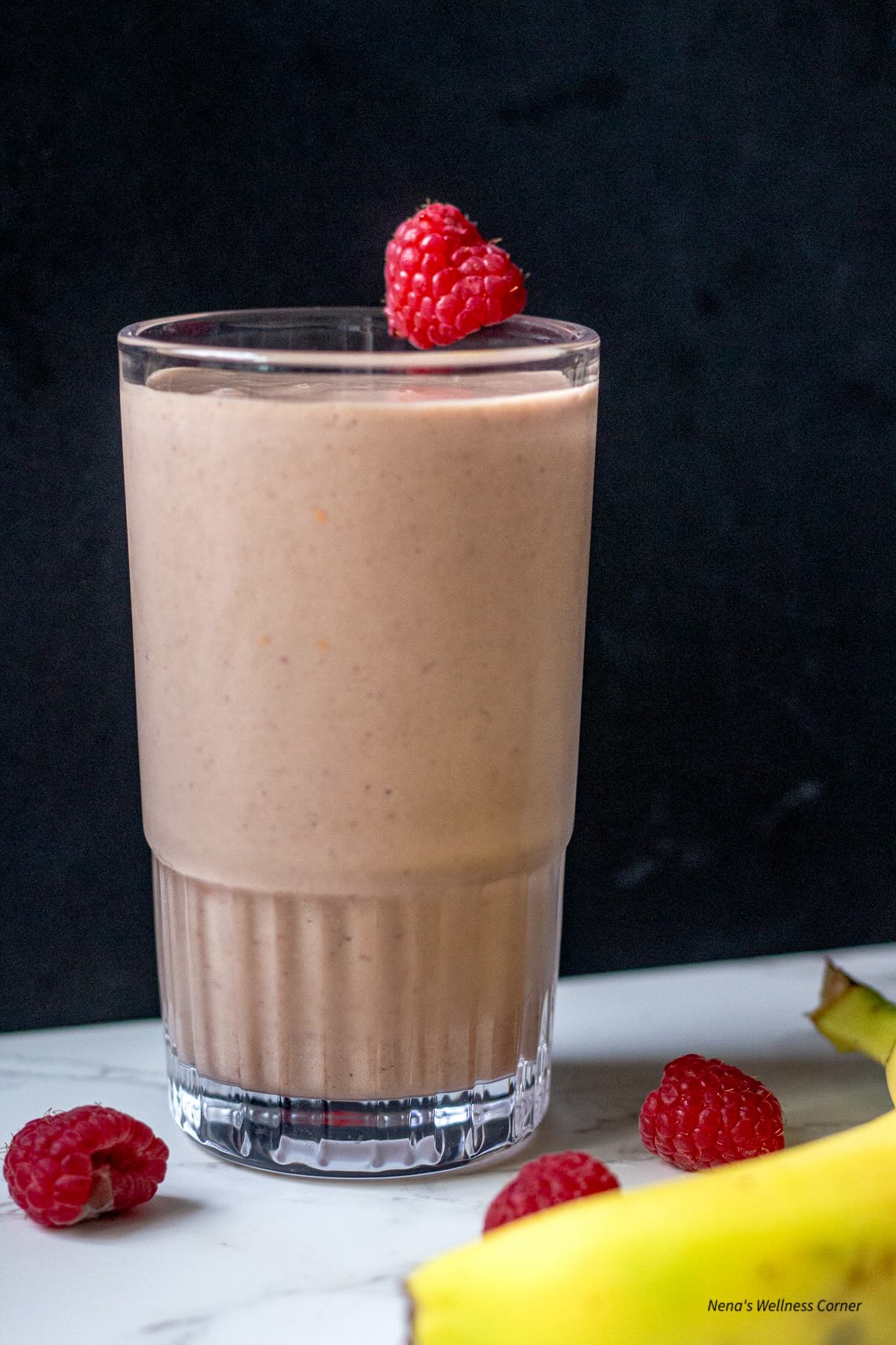 Creamy vanilla raspberry protein smoothie in a cup 1