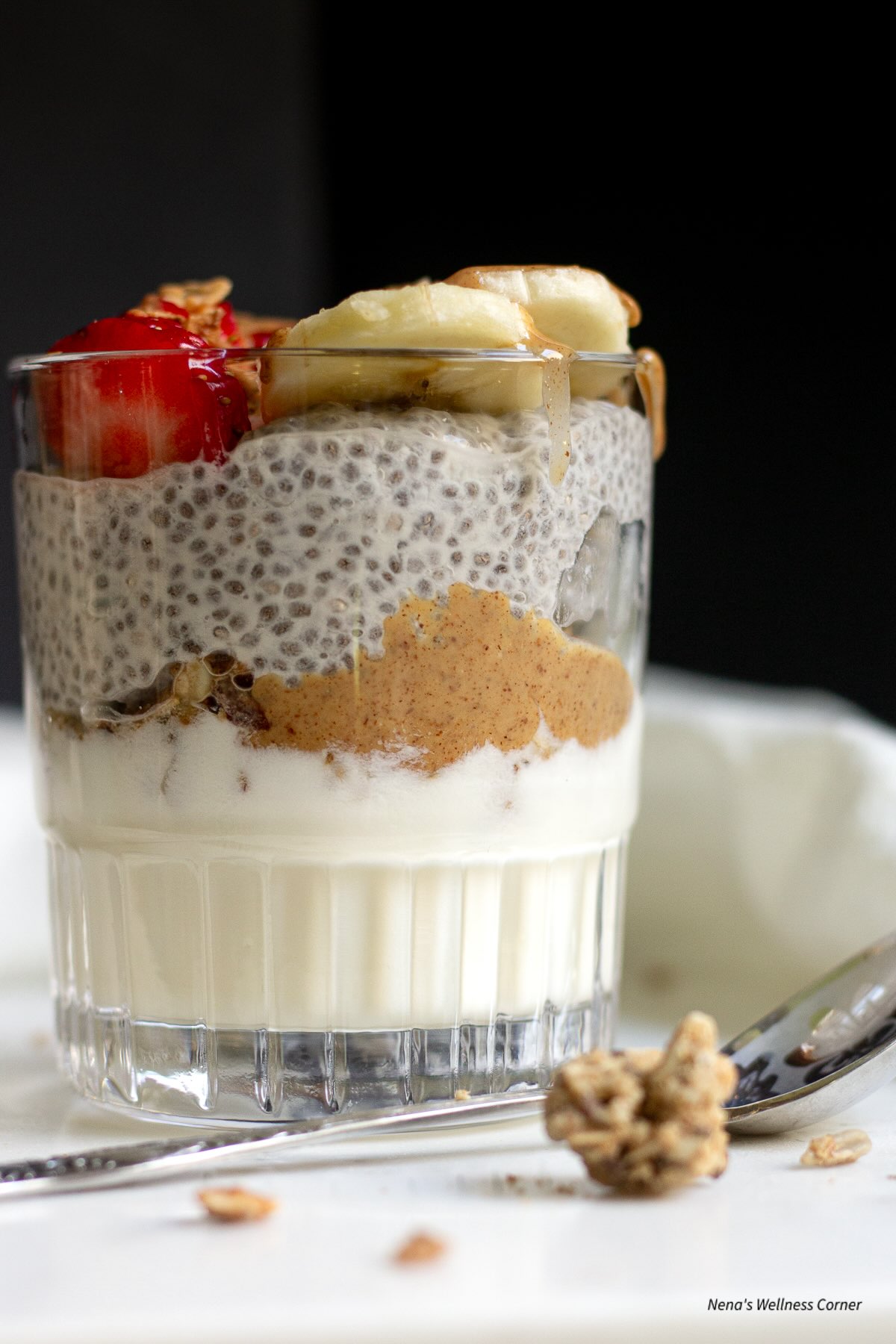 Chia Yogurt Parfait served in a glass and topped with granola and fruit