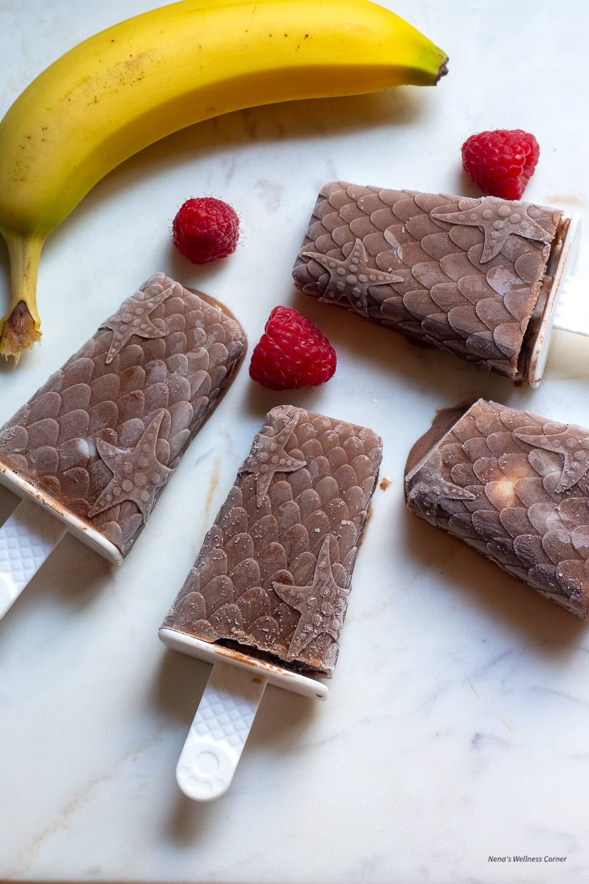 Creamy chocolate banana and raspberry popsicles