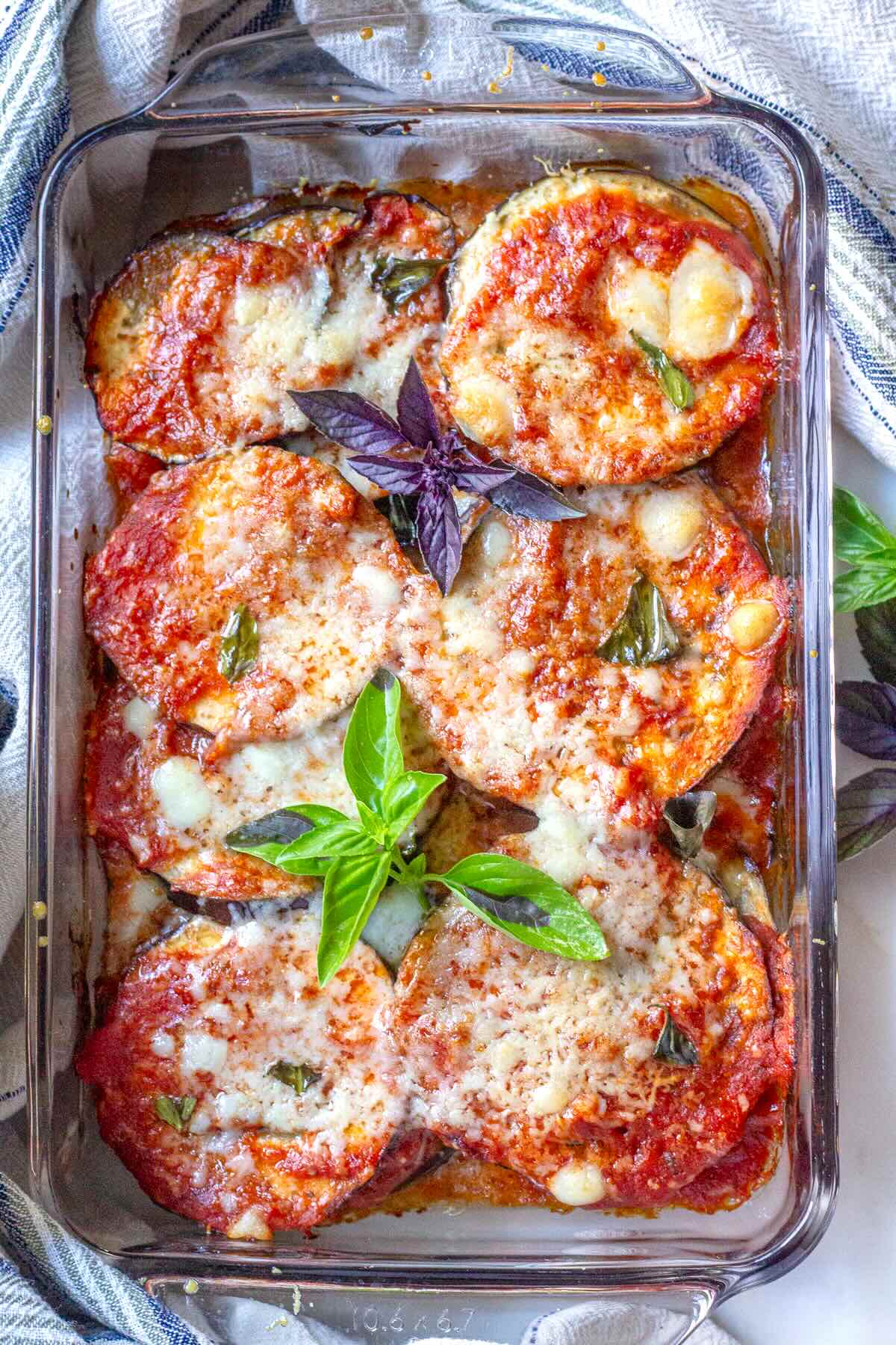 Close-up of gooey melted mozzarella on baked cheesy eggplant.