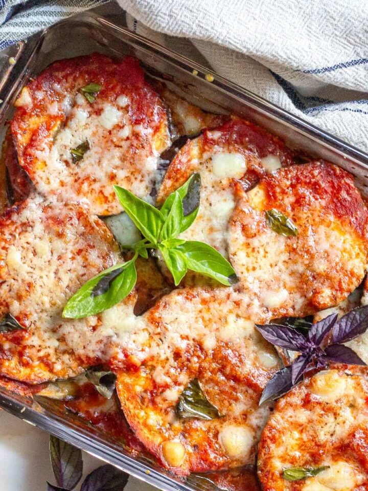 Close-up of gooey melted mozzarella on baked cheesy eggplant.