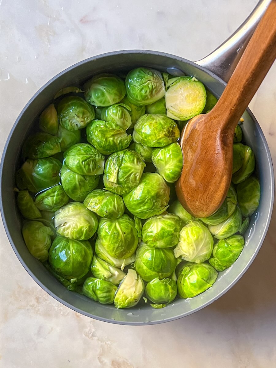 Oven Baked Brussels Sprout with Prosciutto, boil the Brussels sprouts.
