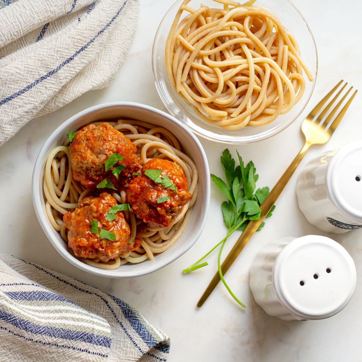 Mini Turkey Meatballs with Tomato Sauce served in a bowl over spaghetti