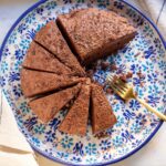 Almond Flour Chocolate Cake with Chocolate Ganache shown on a serving plate