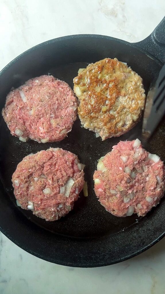 cast-iron turkey burgers preparation, step 4, cook the turkey burgers.