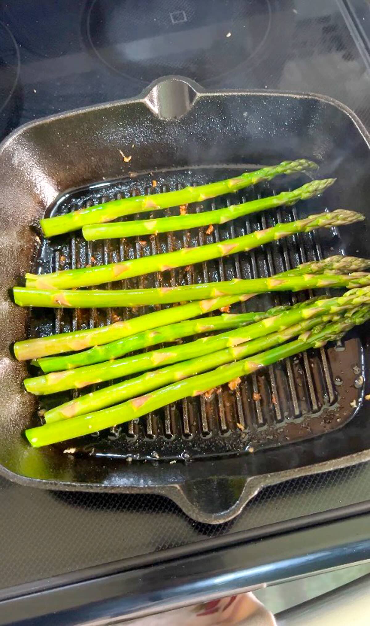 Mahi mahi burgers Grilled asparagus shown on the grill pan
