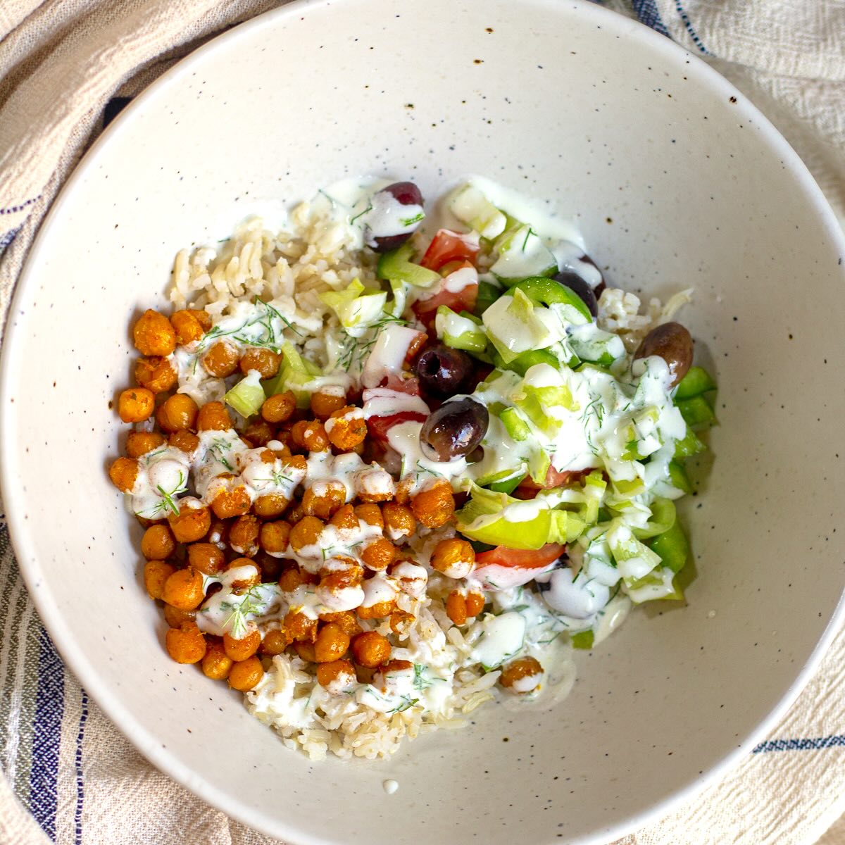 Roasted Chickpea Mediterranean Salad served with yogurt dill dressing