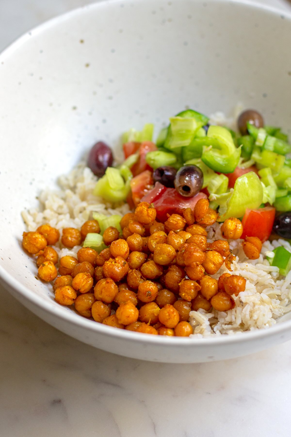 Roasted Turmeric Chickpeas added to a Mediterranean Salad