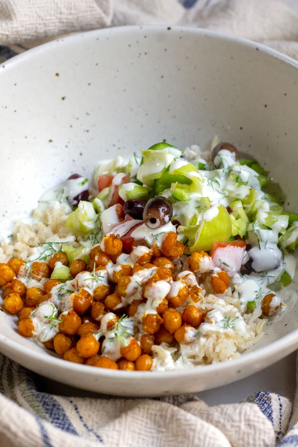 Roasted Chickpea Mediterranean Salad served with dill yogurt dressing