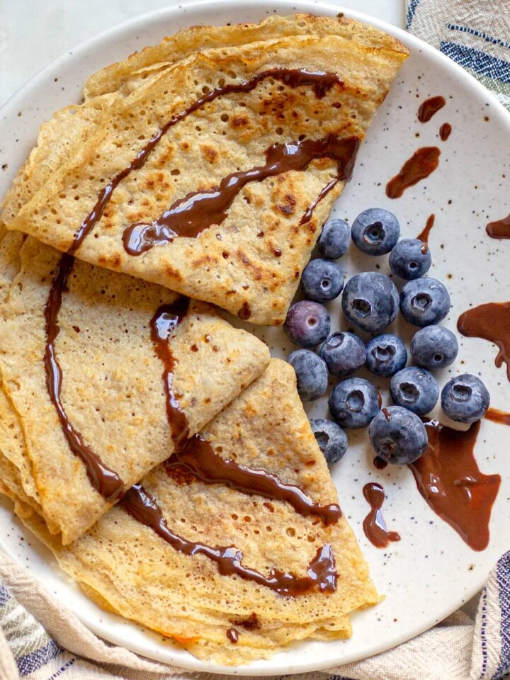 Whole-wheat crepes served on a plate with blueberries