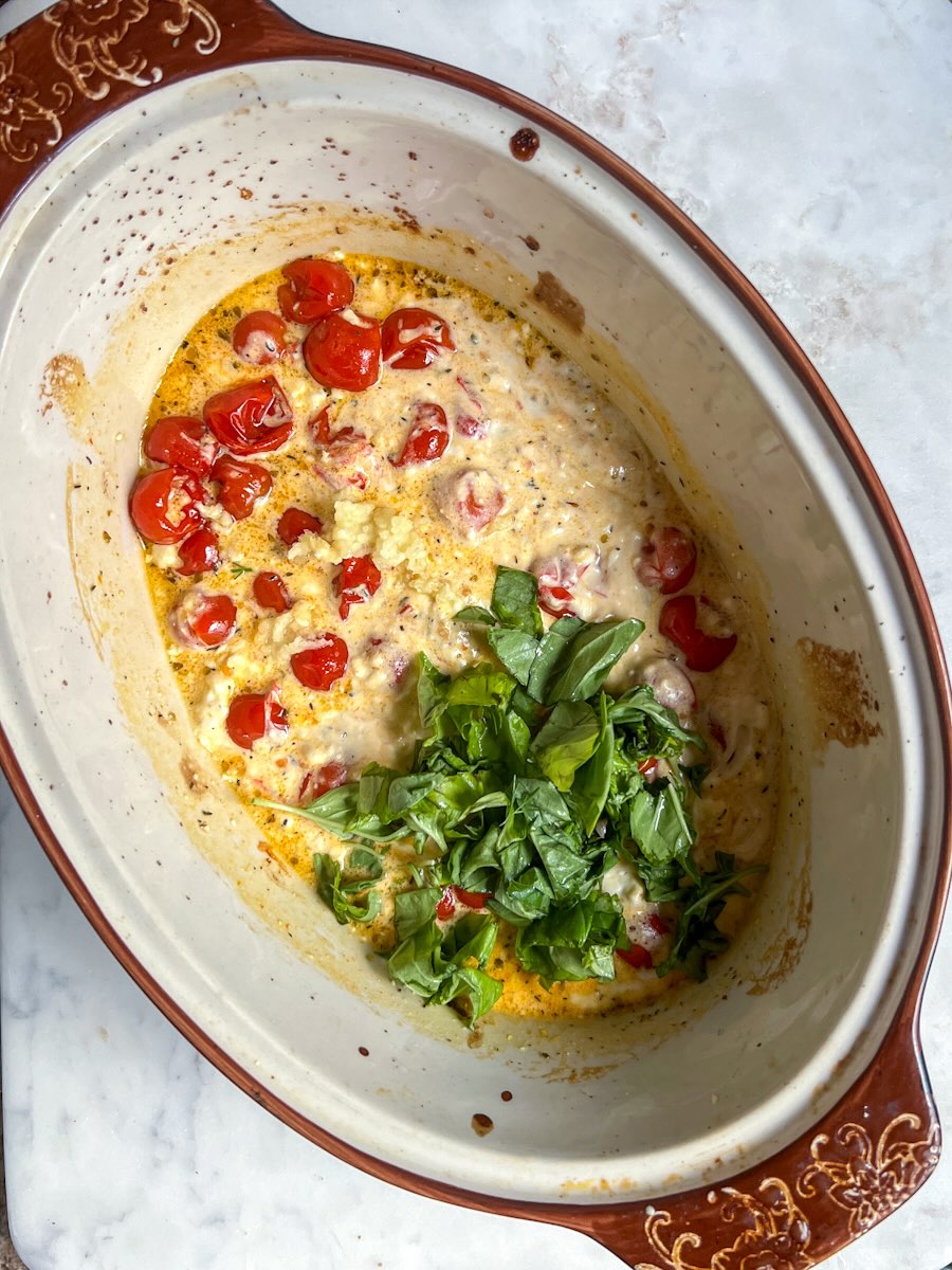 Baked feta pasta, add basil leaves.