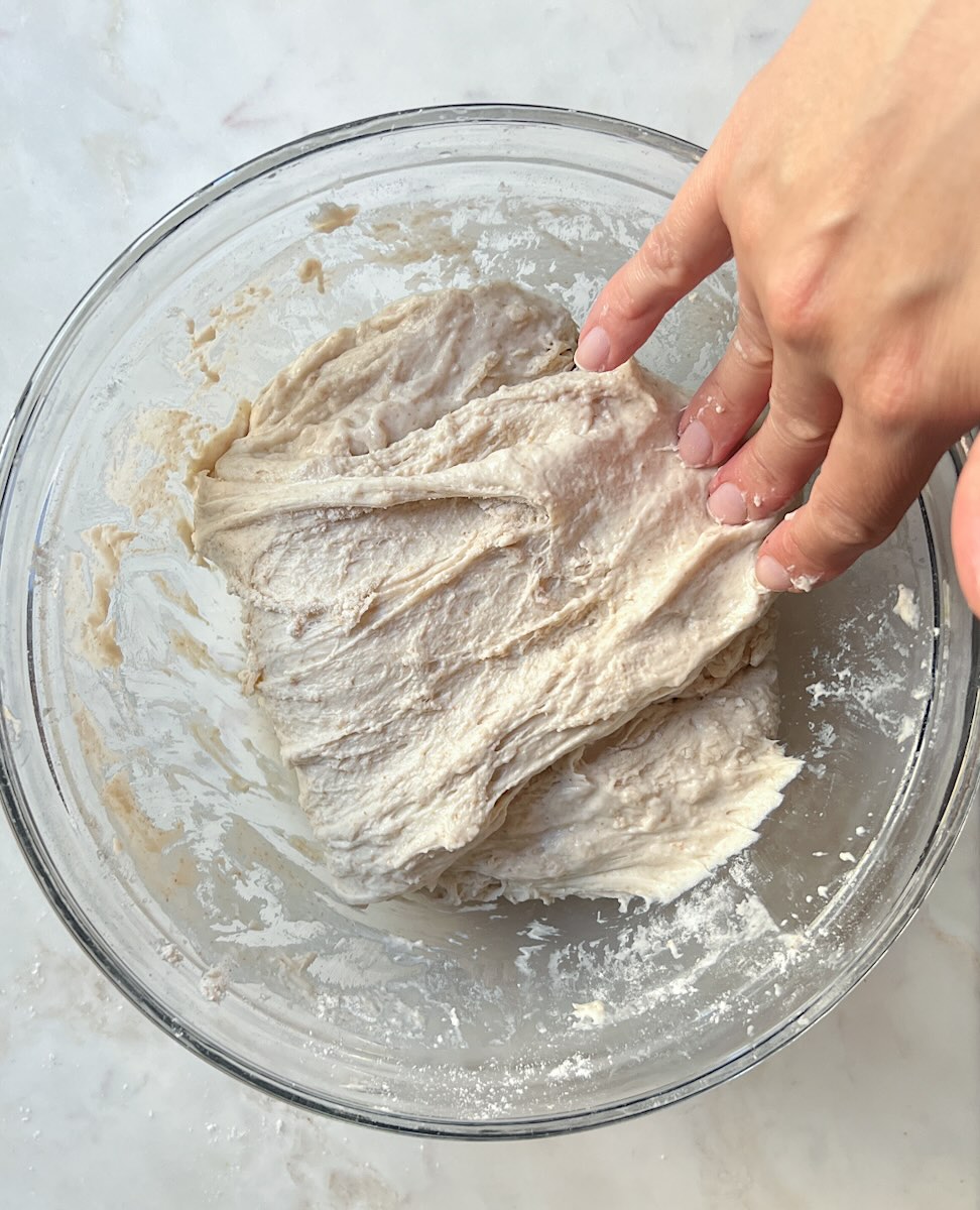 Sourdough bread recipe for beginners, strech and fold the dough.