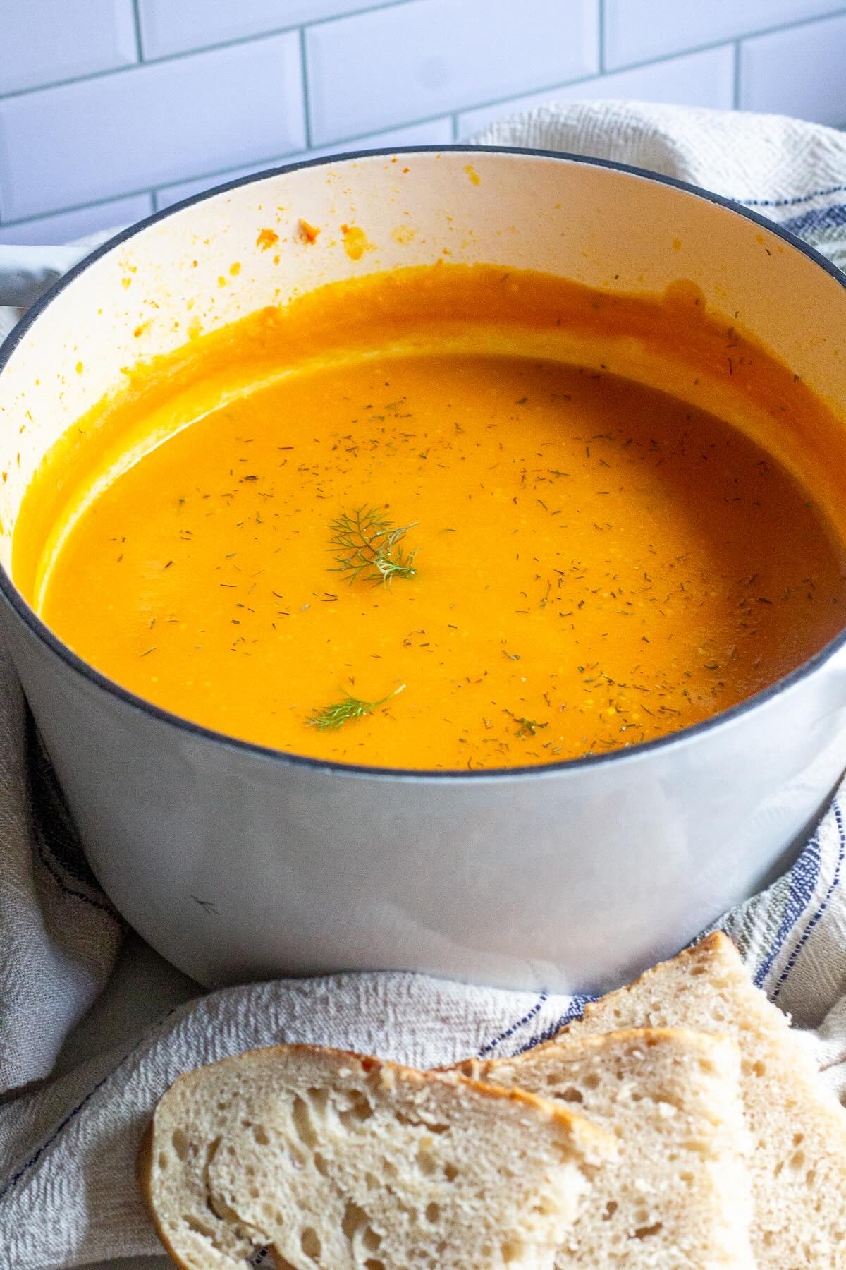 Sweet potato zucchini soup with in a pot.