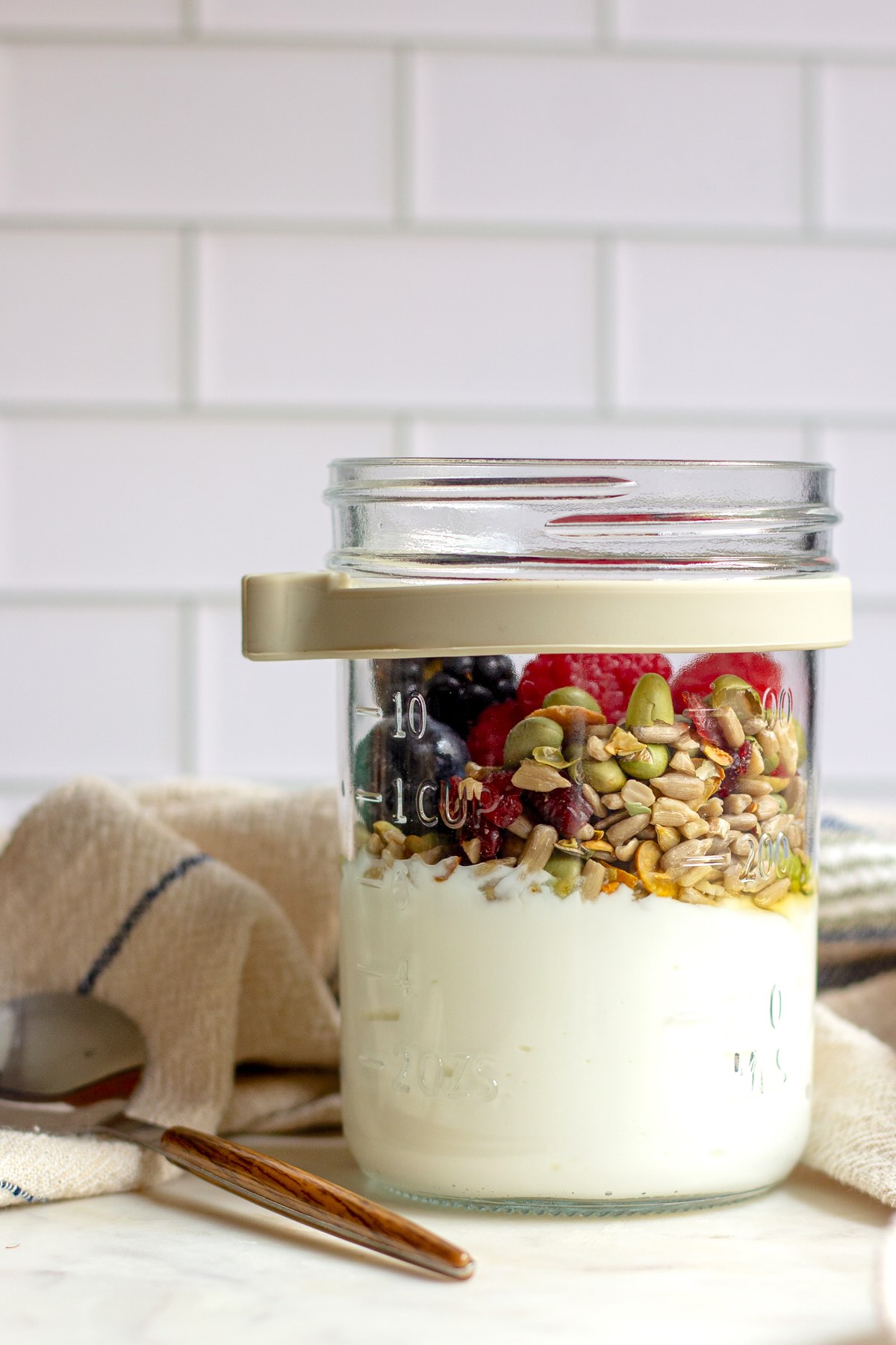 High-protein Greek yogurt parfait made with fresh berries and nuts. 