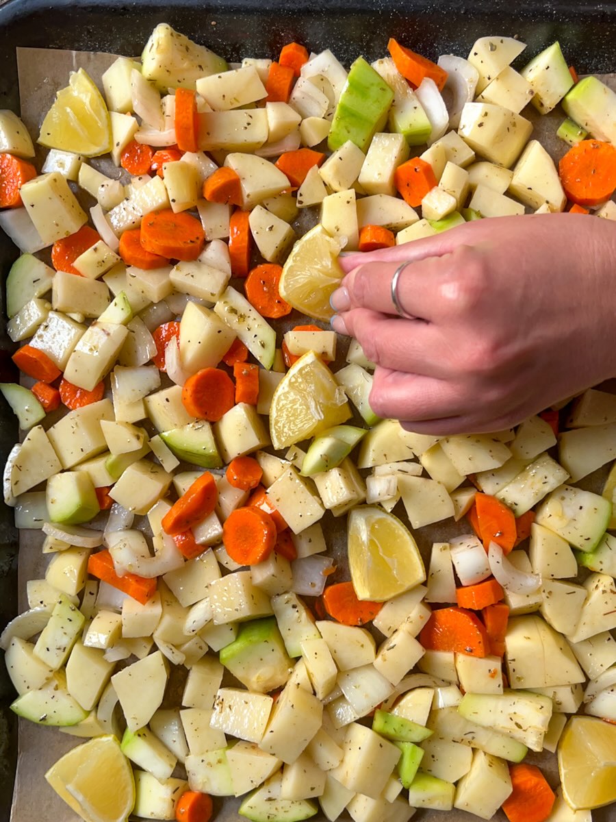 Oven roasted potatoes and carrots with onion and zucchini, add lemon wedges.