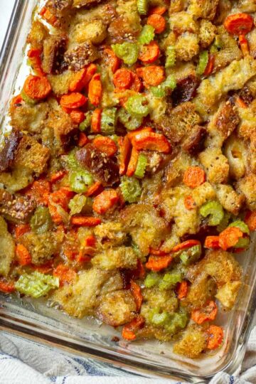 Vegetable stuffing casserole ready to be served at Thanksgiving dinner.