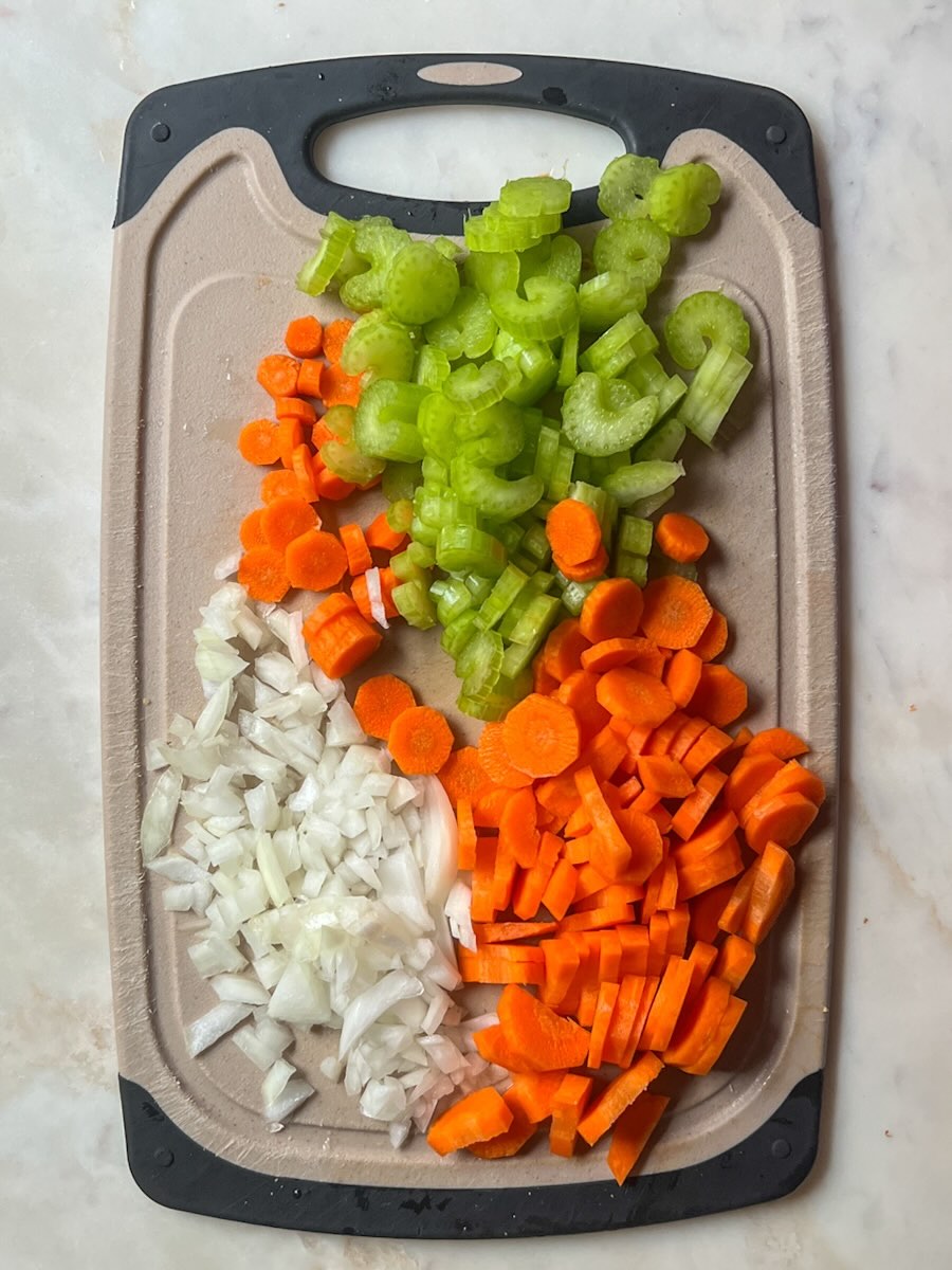 Vegetable stuffing casserole, chop carrots, celery, and onions.